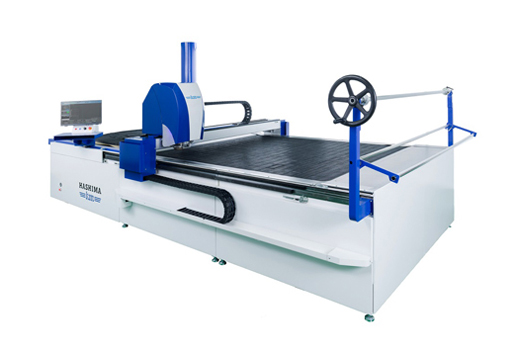 Industrial fabric cutting equipment used in textile processing